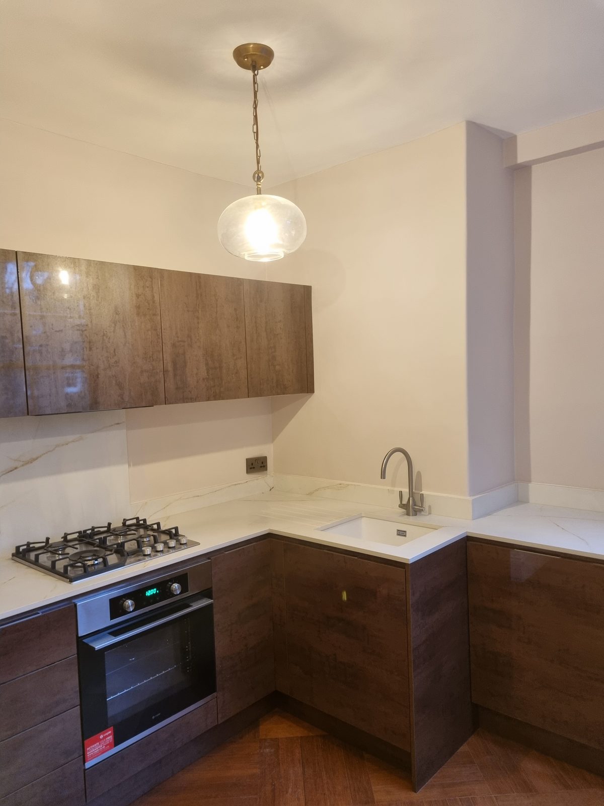 Kitchen. Bronze fronts, white quartz.